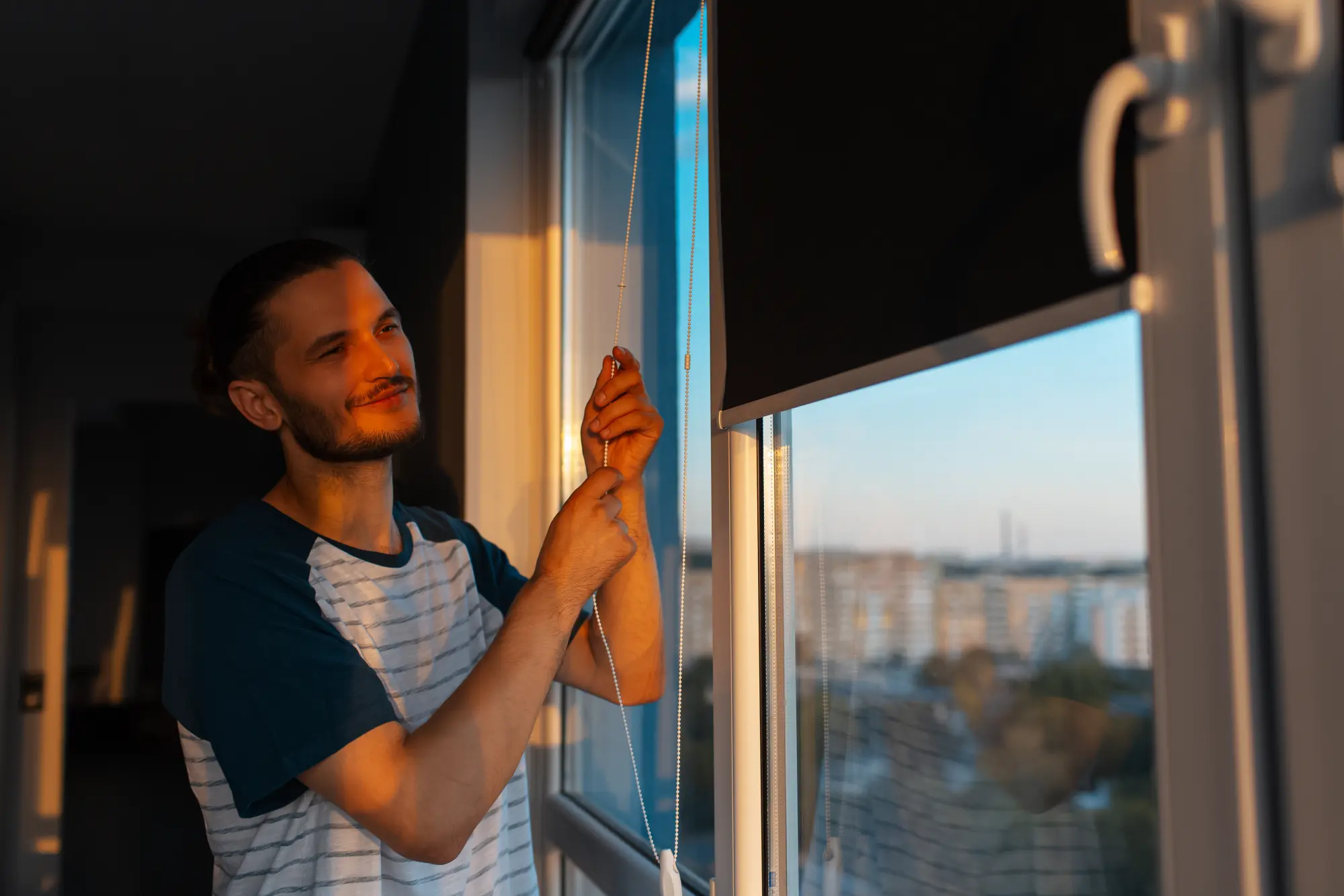 portrait-young-man-closes-rolled-jalousies-sunny-day-sunset.webp